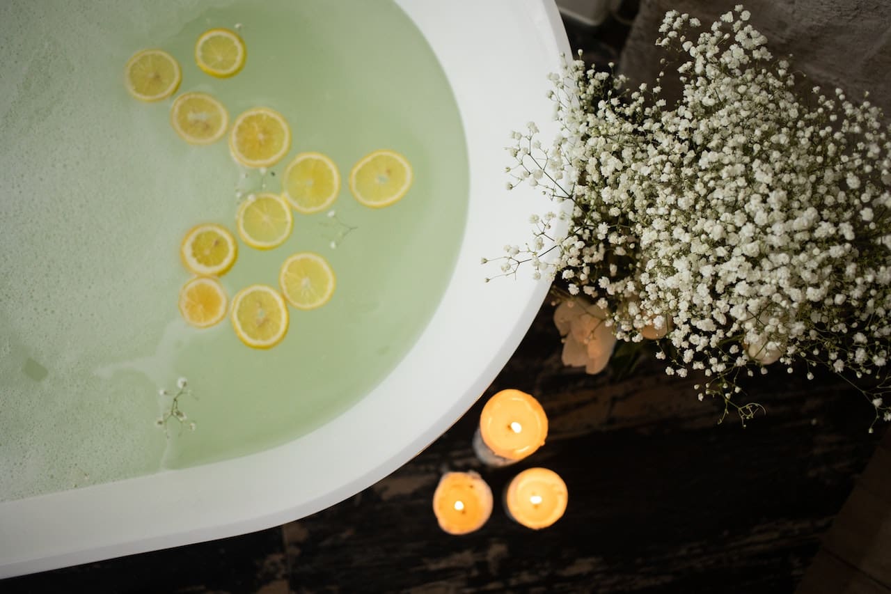 An image of a father in Sugar Land filling a bathtub with discolored water while his family looks on, illustrating potential issues with water quality for bathing.