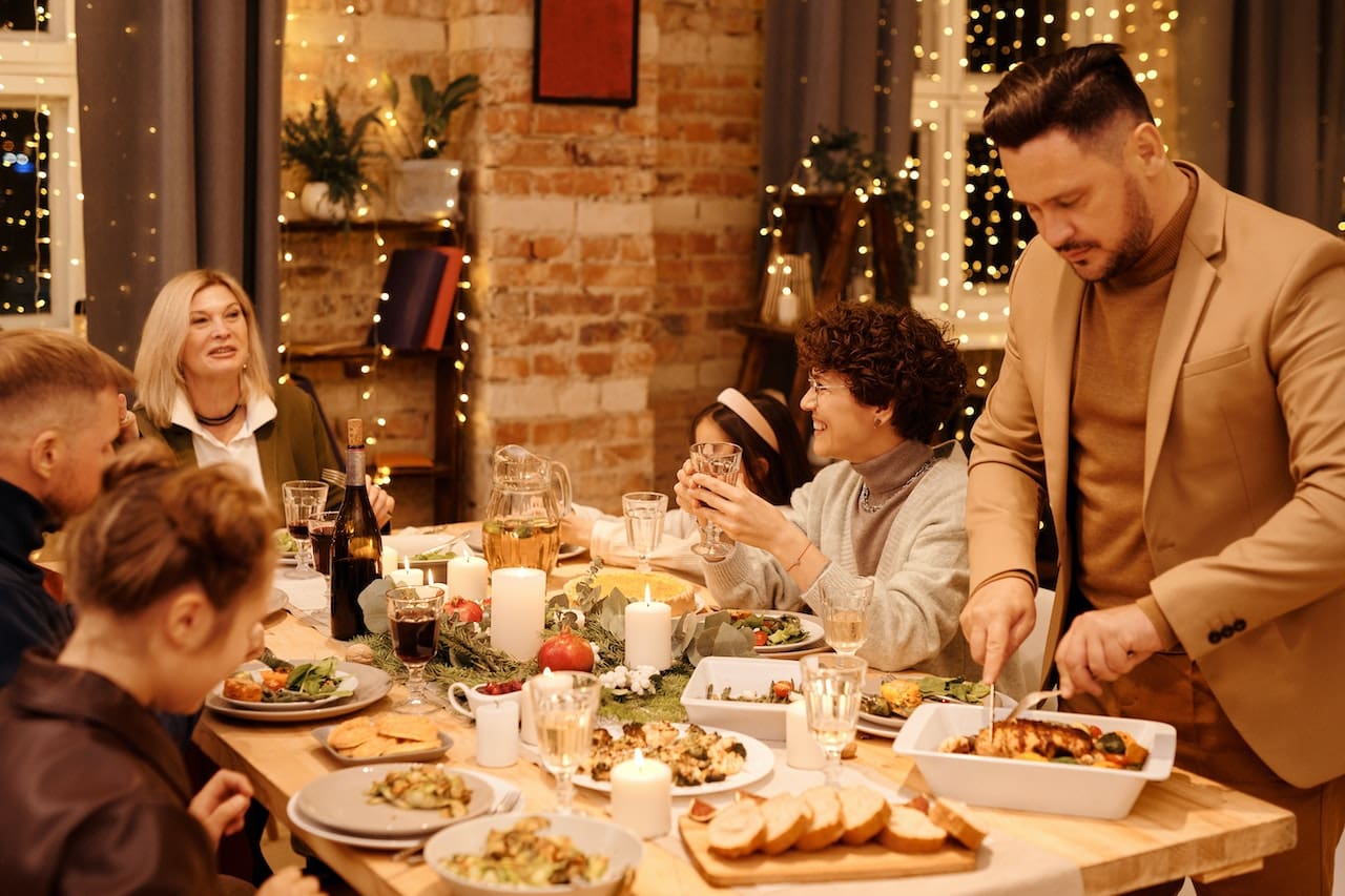 A cozy evening snapshot of a family enjoying a backyard barbecue with friends, sipping on refreshing beverages made with high-quality water, highlighting the joy of outdoor gatherings in Irving.