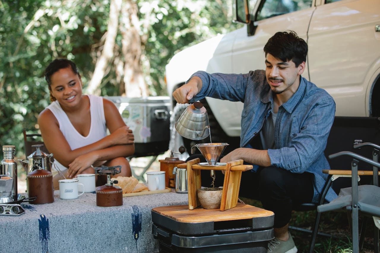 An image of a homeowner frustrated by the buildup of scale and stains in a kettle, emphasizing the need for filtered water for cooking and preventing mineral deposits in Atascocita homes.